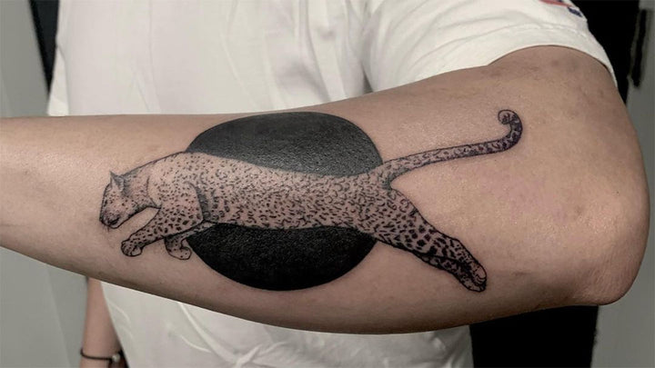 leopard tattoo on forearm 