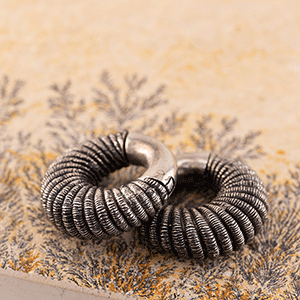 formed ear weights for ear lobe piercings done at Vancouver best tattoo and piercing shop