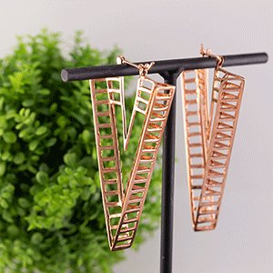 rose gold triangle dangles for ear piercing done at vancouver piercing shop The FALL