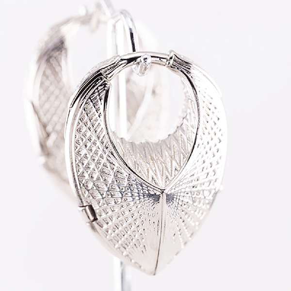 silver hand carved earring dangles for healed ear piercings in vancouver